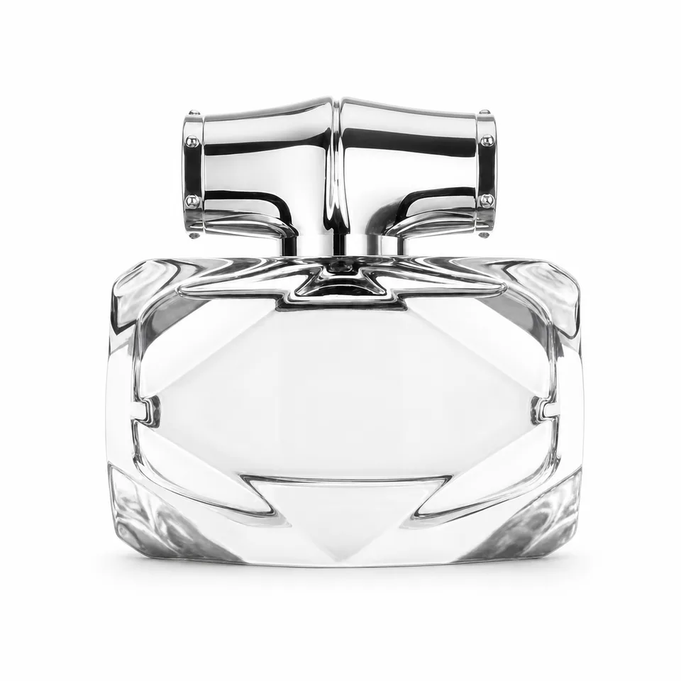 Low wide faceted clear glass perfume bottle with silver bamboo-style cap