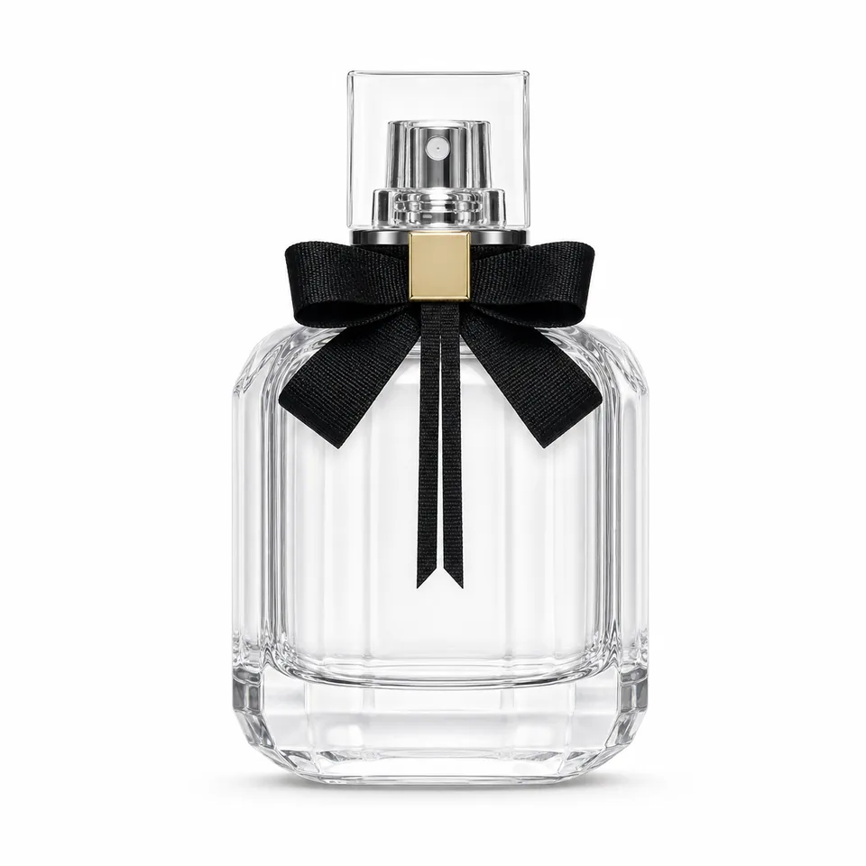 Pale clear rounded-rectangular glass perfume bottle with black bow