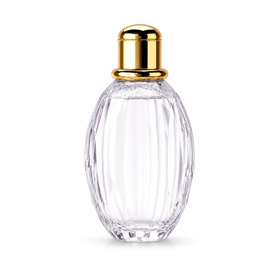 Small oval vertically faceted clear glass perfume bottle with gold dome cap